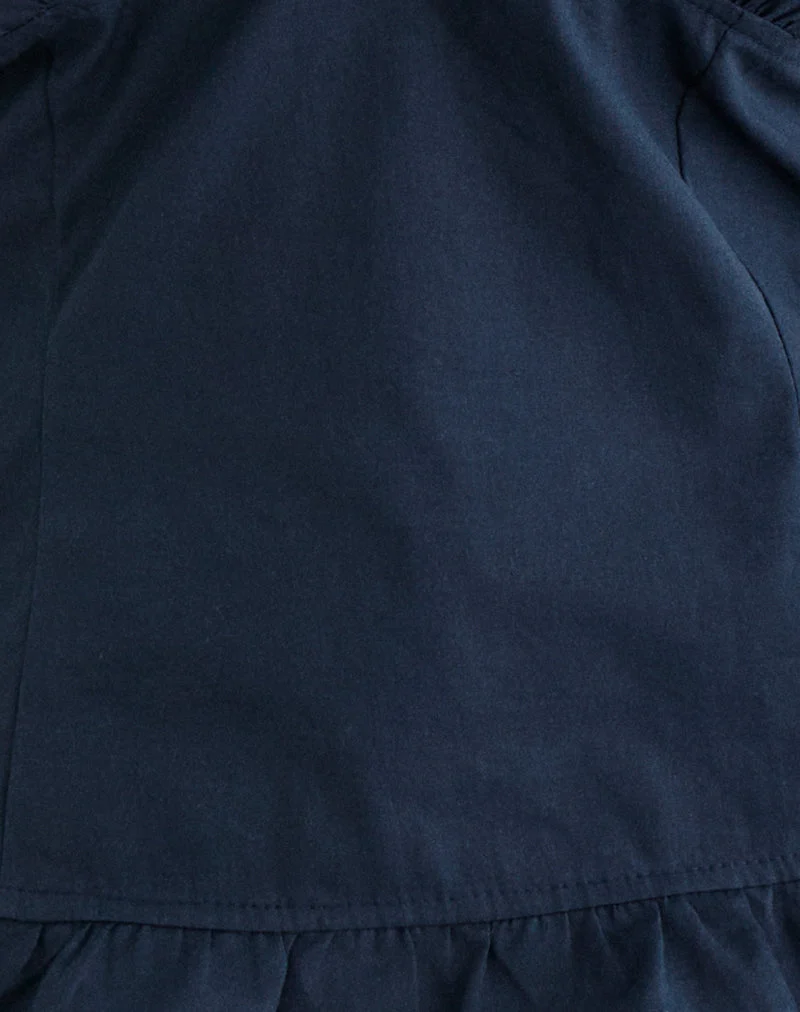 Tamzen-Top mit Halterneck in Dunkelblau und Rüschen am Saum